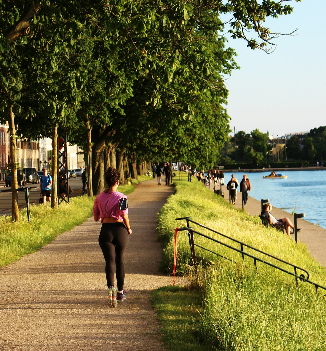 Woman walking on a riverside path