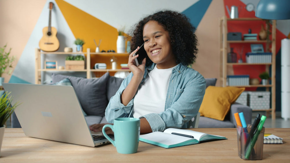 Woman smiling on a phone call at home
